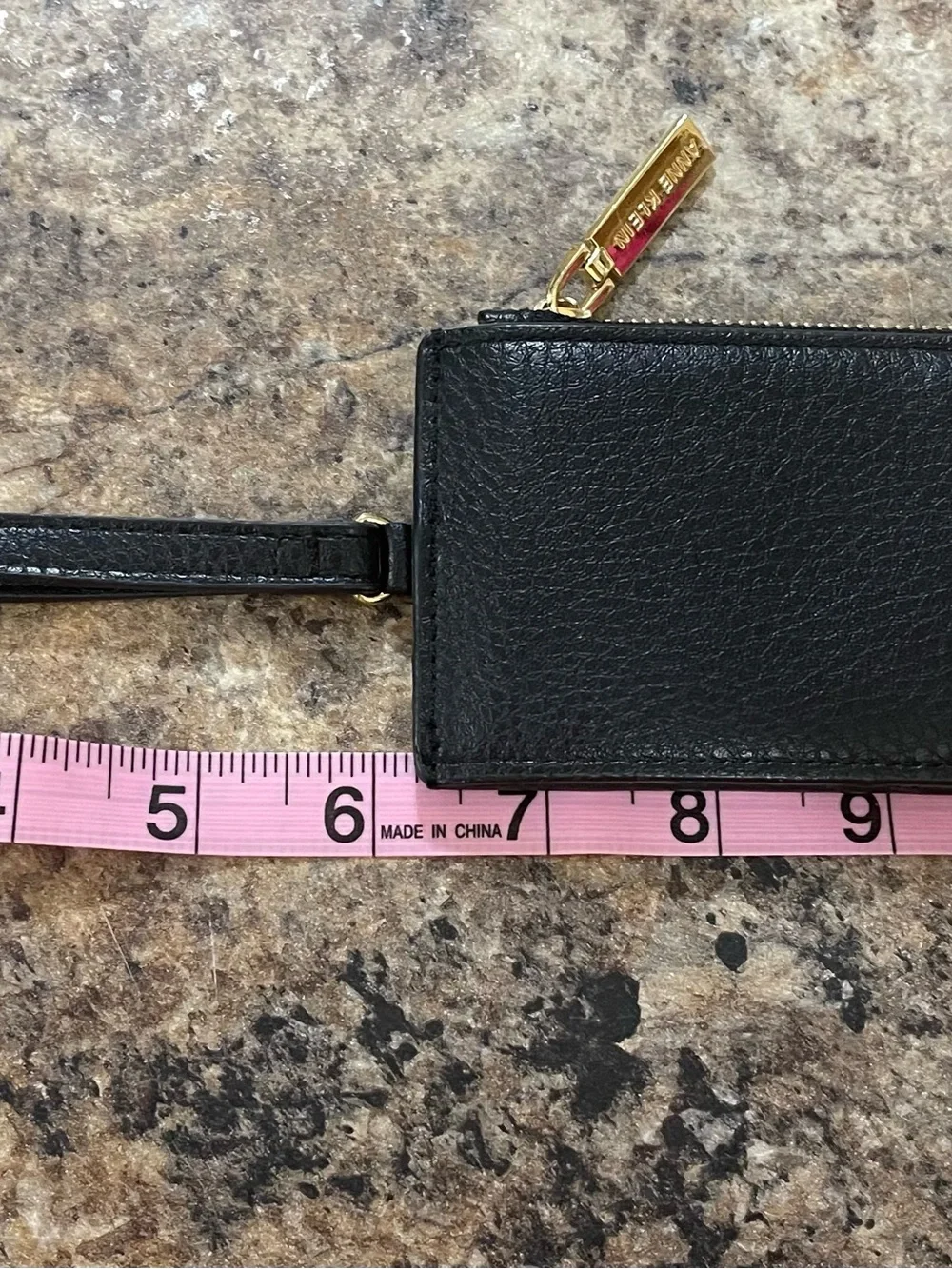 Anne Klein black pebble leather zip wristlet with gold hardware
